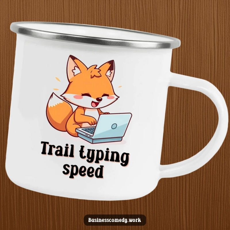 Funny playful fox typing on a laptop on a camping mug, looking energized, a humorous outdoor adventure accessory.